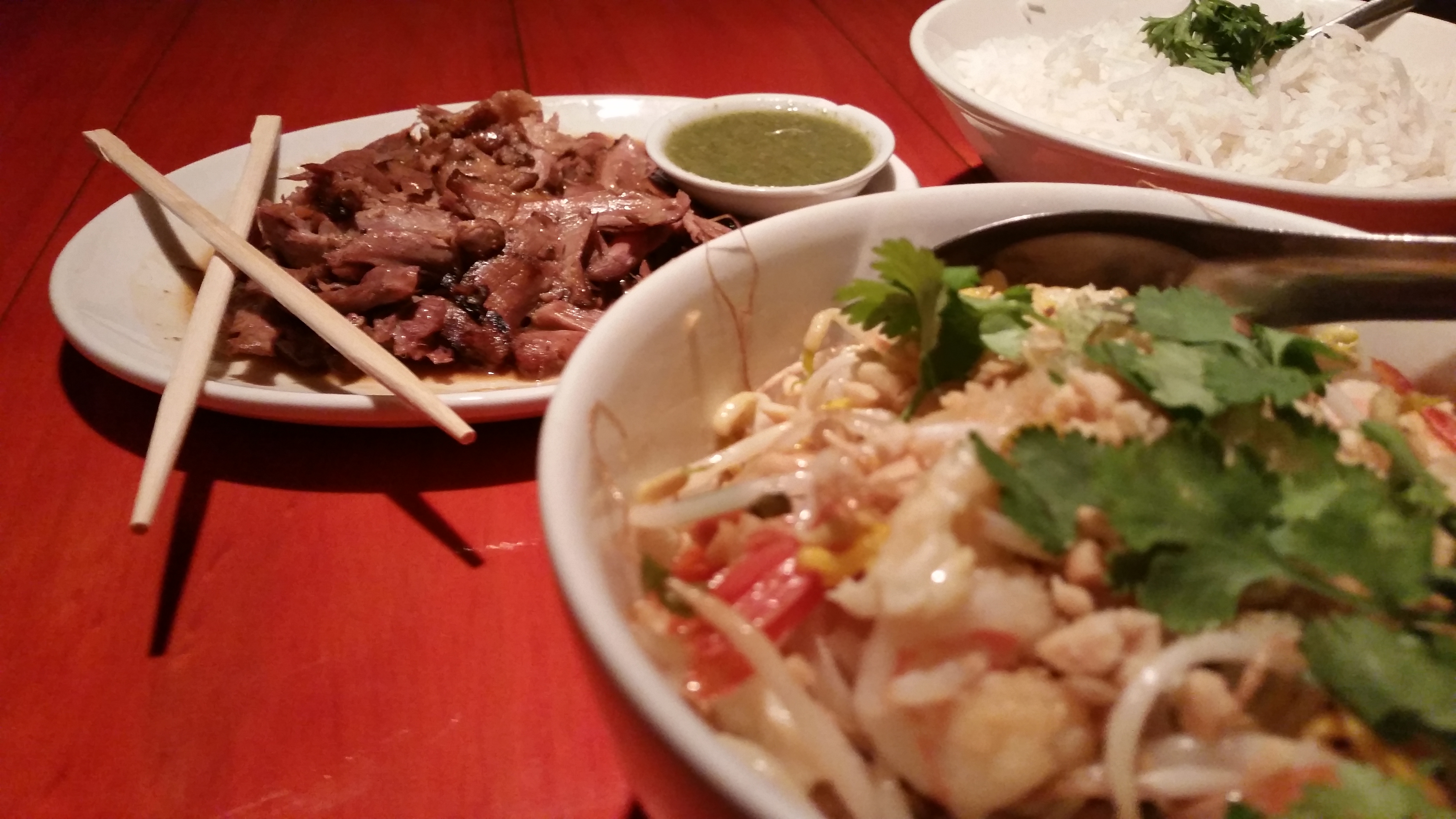 The prawn fried noodle dish is at the front and, in the back, the roast duck with green sauce