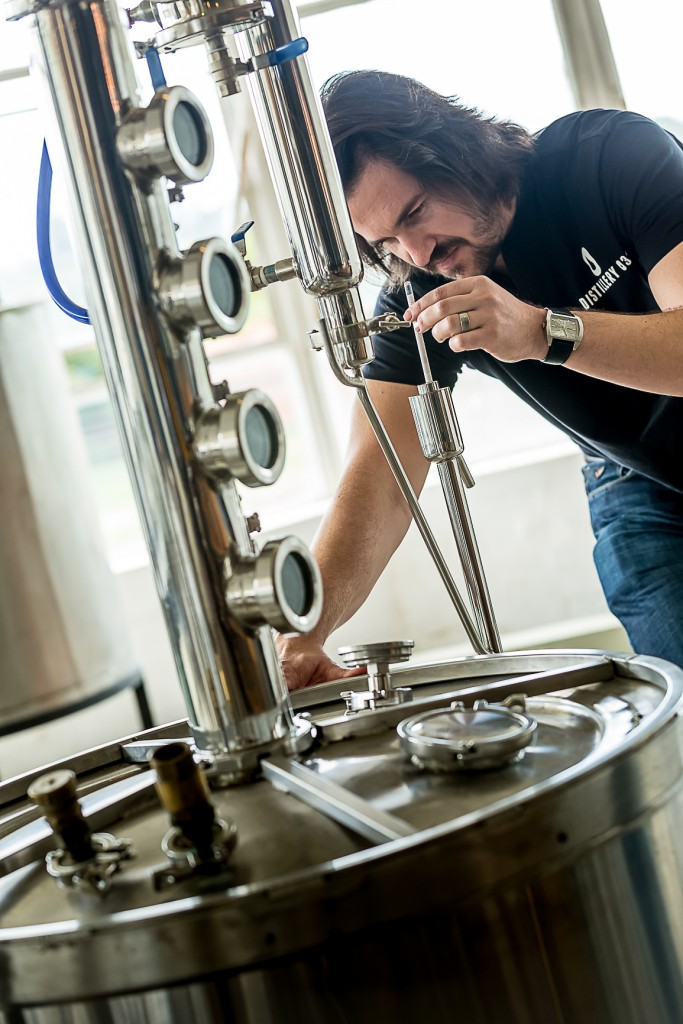 Andrew Rall demonstrating the distilling process