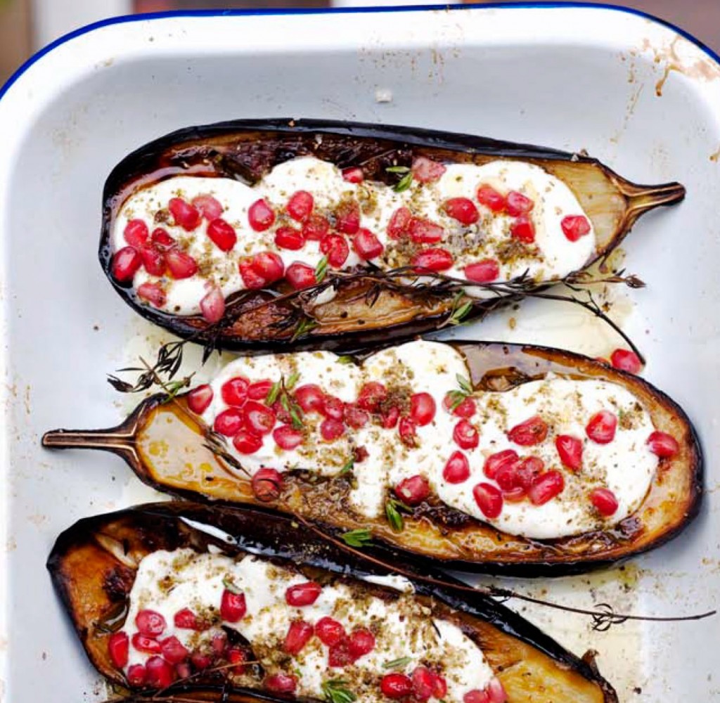 Aubergine with buttermilk sauce and topped with pomegranate seeds